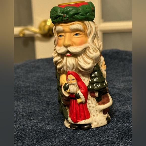 Set of 2 Santa candleholders. Each has smaller different smaller Santas. - Picture 1 of 11